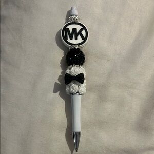 Michael Kors Black and White Pom-Pom Accessory